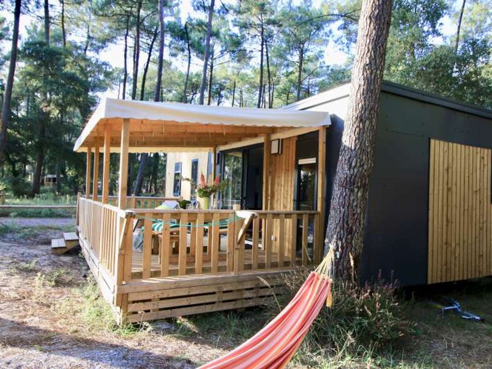 Camping du Lac - Lodge - Lodge 5 personnes - Cottage Premium Cocoon 4/5p. - 2 chambres - TV - Climatisation Camping du Lac - Lodge - Lodge 5 personnes - Cottage Premium Cocoon 4/5p. - 2 chambres - TV - Climatisation